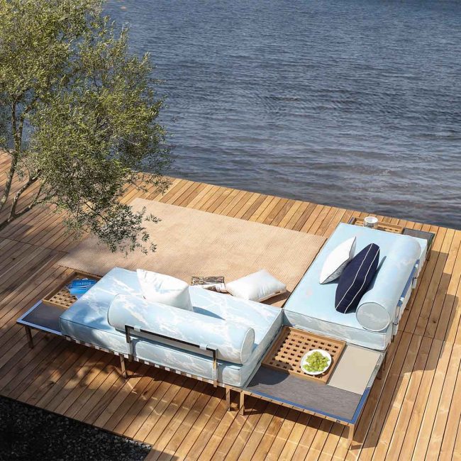 commercial-outdoor-lounge-settings-corner commercial outdoor lounge setting in sky blue fabric in a daybed configuration