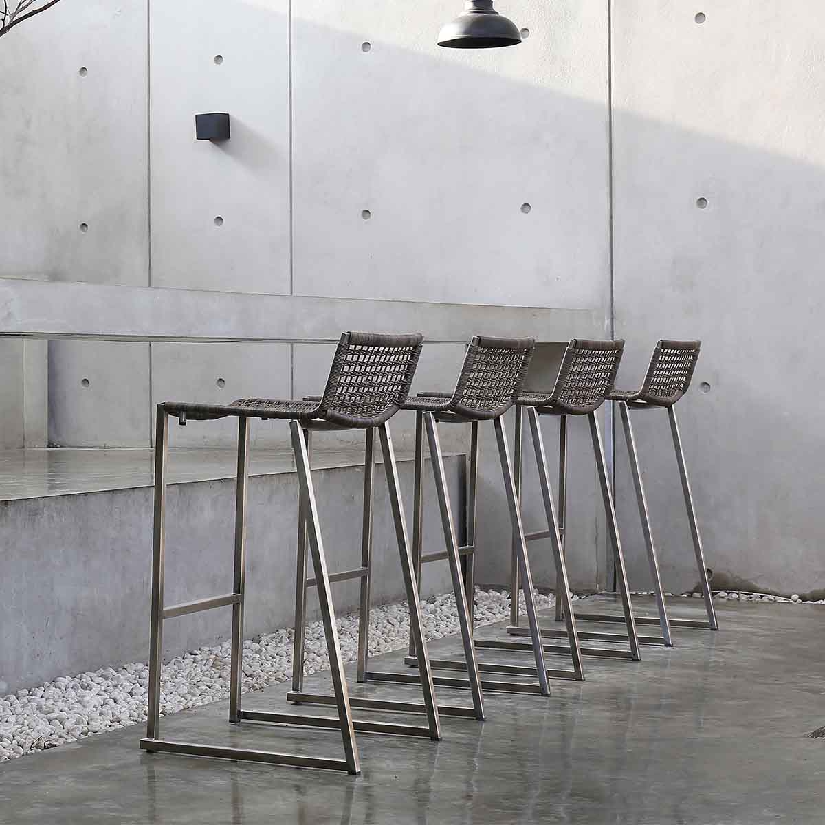 commercial outdoor bar chairs with a long concrete bar